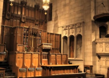 An altar sits in a bright Presbyterian Church hall.