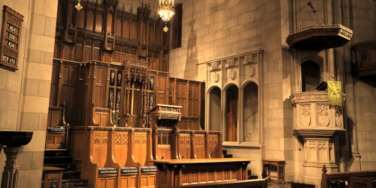 An altar sits in a bright Presbyterian Church hall.
