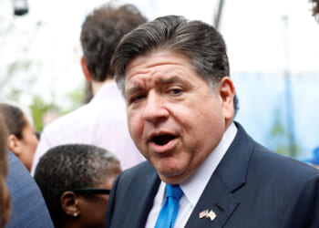 Illinois Gov. JB Pritzker looks on with his mouth open.