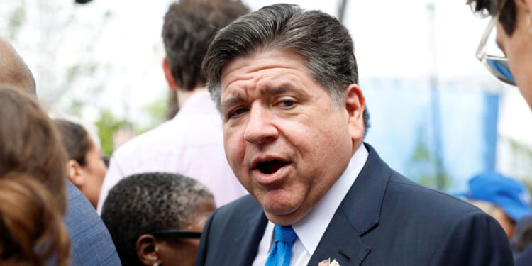 Illinois Gov. JB Pritzker looks on with his mouth open.