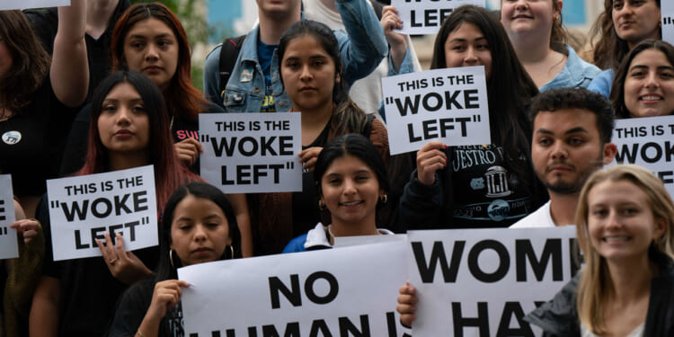 Protesters gather outside the University of North Carolina Chapel Hill where former US Vice President Mike Pence speaks about "Saving America from the Woke Left," in Chapel Hill, North Carolina, on April 26, 2023.
