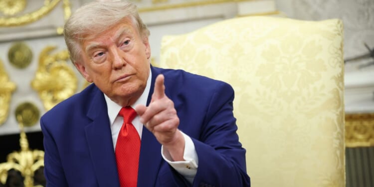 President Donald Trump takes questions from the media Tuesday in the Oval Office of the White House in Washington, D.C.