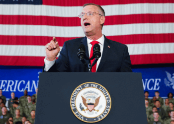 Secretary og Veterans Affairs Doug Collins speaks before Vice President JD Vance during an event marking 250 years of the American military at Naval Air Station Oceana in Virginia Beach, Virginia, on July 1, 2026. (Ken Cedeno/AFP via Getty Images)