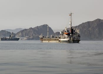 Cargo vessels remain anchored off Port Sultan Qaboos on June 20, 2026, in Muscat, Oman.