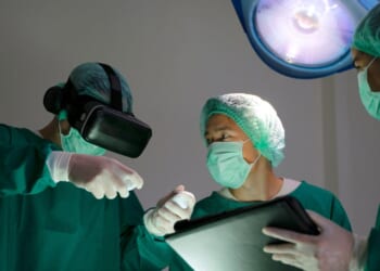 Doctors in surgery in an operating room.