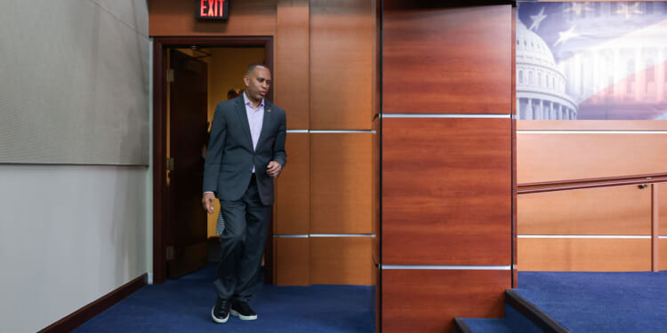 House Minority Leader Hakeem Jeffries arrives for a news conference at the U.S. Capitol.