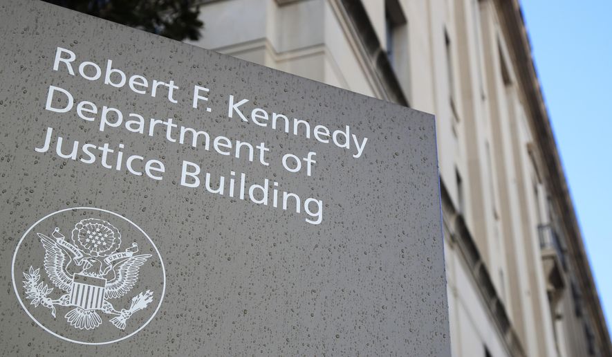 This Friday, March 22, 2019, fie photo shows the Department of Justice Building in Washington. (AP Photo/Manuel Balce Ceneta) ** FILE **