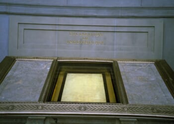 The Declaration of Independence, displayed in a dimly lit hall at the National Archives, reserved for the original Charters of Freedom in Washington, D.C.