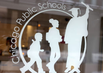 A sign is displayed on the front of the headquarters for Chicago Public Schools.
