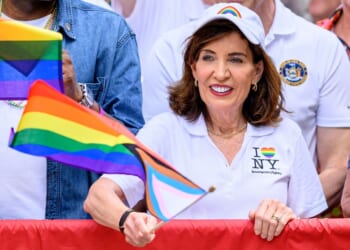 New York Gov. Kathy Hochul waves a transgender flag during the 2026 "Pride March" on June 28 in New York City.