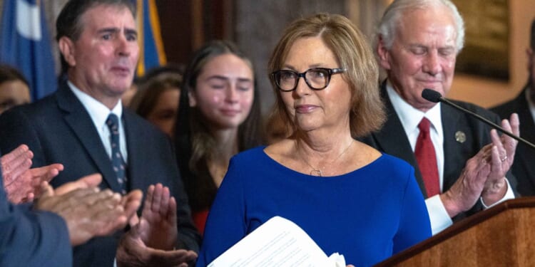 Darline Graham Nordone, sister of the late GOP Sen. Lindsey Graham, speaks during a news conference Monday outside the Governor's South Carolina State House office in Columbia, South Carolina.