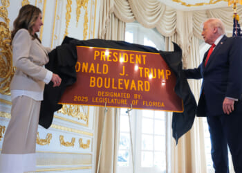 Florida State Rep. Meg Weinberger and U.S. President Donald Trump unveil a "President Donald J. Trump Boulevard" sign during a Road Dedication Ceremony at Mar-a-Lago.