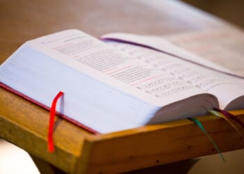 A bible sits on a church pulpit.