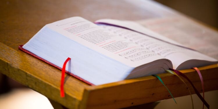A bible sits on a church pulpit.
