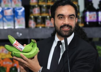 New York City Mayor Zohran Mamdani holds up bananas as he speaks at a food distribution center Monday in the Brooklyn borough of New York City.
