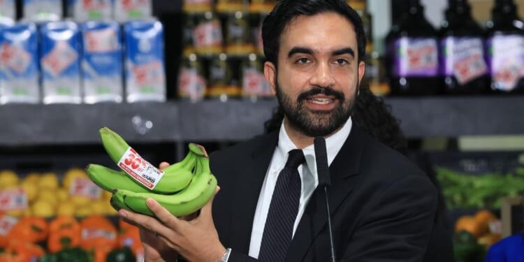 New York City Mayor Zohran Mamdani holds up bananas as he speaks at a food distribution center Monday in the Brooklyn borough of New York City.