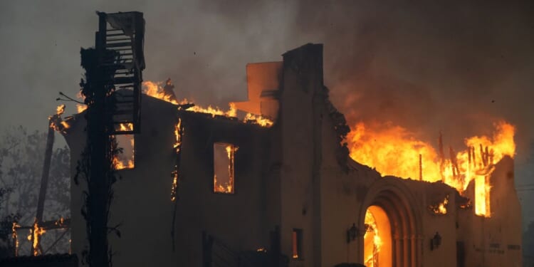 The Altadena Community Church burns during the Eaton Fire on Jan. 8, 2025, in the Altadena section of Pasadena, California.