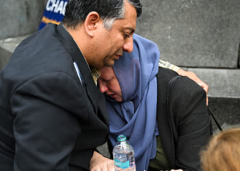 Two people cry during the memorial as hundreds of pro-Palestinian protesters gathered in Washington.