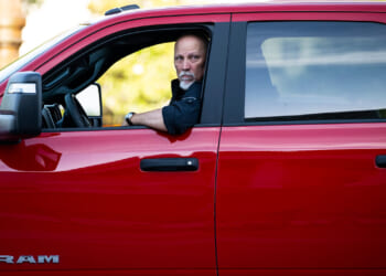 Rep. Chip Roy of Texas arrives in a red pickup truck for votes in the U.S. House.
