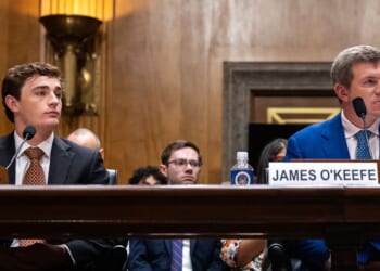 Conservative YouTuber and influencer Nick Shirley, left, and CEO of O’Keefe Media Group James O'Keefe listen Wednesday during a Senate Homeland Security and Governmental Affairs Committee hearing on exposing fraud in Washington, D.C.
