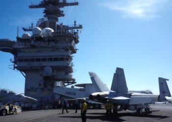 U.S. Navy aircraft sit on the flight deck of the USS Theodore Roosevelt aircraft carrier in Honolulu, Hawaii, on July 17, 2026.
