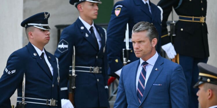 Secretary of War Pete Hegseth waits for the arrival of Iraqi Prime Minister Ali al-Zaidi during an arrival ceremony at the Pentagon in Washington, D.C., on July 14, 2026.
