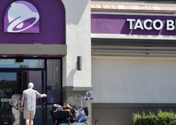 Customers enter a Taco Bell restaurant on July 14, 2026, in La Cañada Flintridge, California.