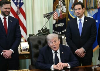 Vice President J.D. Vance, left, and Secretary of State Marco Rubio, right, listen to President Donald Trump speak during a meeting April 23 in Washington, D.C.