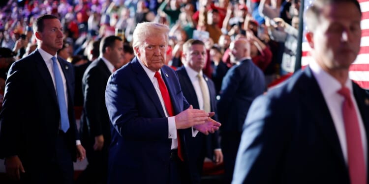 Surrounded by U.S. Secret Service agents, President Donald Trump leaves the the Santander Arena following a campaign rally on Nov. 4, 2024, in Reading, Pennsylvania.