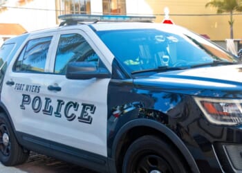 Police cars from the Fort Myers Florida Police Department secure the downtown district for a festival on Oct. 6, 2023.