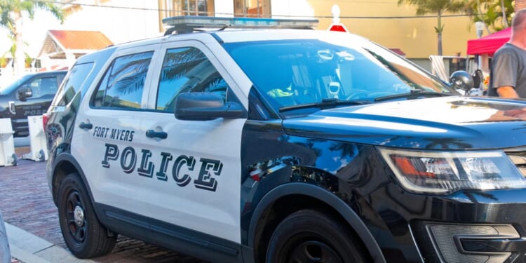 Police cars from the Fort Myers Florida Police Department secure the downtown district for a festival on Oct. 6, 2023.