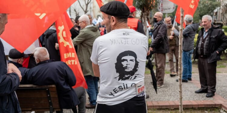A protestor stands with Cuban dictator Fidel Castro displayed on the back of his shirt on April 4, 2026 in Izmir, Turkey.