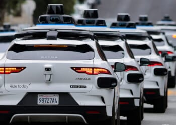 A line of Waymo robot axis drives through North Beach on July 7, 2026 in San Francisco.