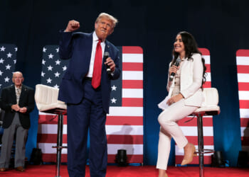 President Donald Trump takes the stage to the chant of "Fight, fight, fight, during a town hall-style campaign event.