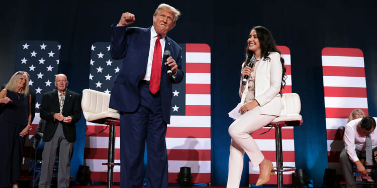 President Donald Trump takes the stage to the chant of "Fight, fight, fight, during a town hall-style campaign event.
