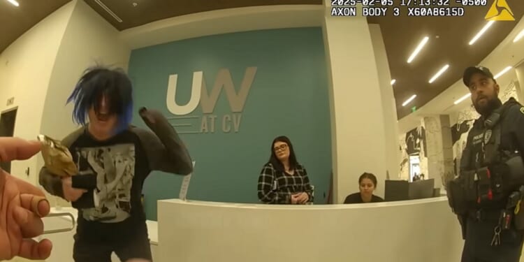A transgender man sceams during a confrontation with police at the University of Central Florida in February 2025.