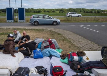 Asylum seekers camp out close to an application center in Ter Apel in the Netherlands on Aug. 28, 2022.