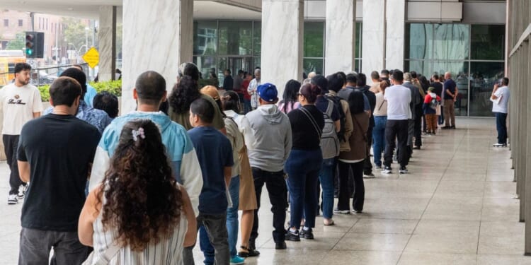 People wait in line to enter the Los Angeles Immigration Court on Wednesday, June 24, 2026.