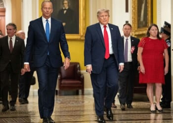 President Donald Trump walks with Senate Majority Leader John Thune of South Dakota on the way to a June 24 lunch meeting with Senate Republicans at the U.S. Capitol in Washington, D.C.