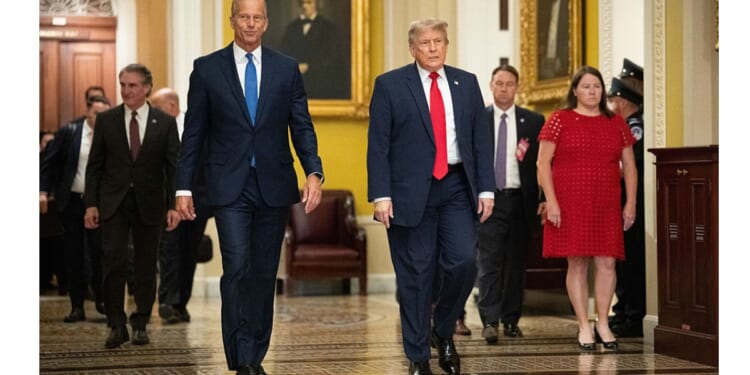 President Donald Trump walks with Senate Majority Leader John Thune of South Dakota on the way to a June 24 lunch meeting with Senate Republicans at the U.S. Capitol in Washington, D.C.