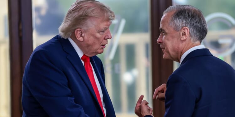 President Donald Trump speaks with Canadian Prime Minister Mark Carney at a June meeting. Trump and Carney painted completely different pictures about the tariff situation between their respective countries this week.