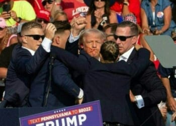 President Donald Trump is seen with blood on his face surrounded by Secret Service agents as he is taken off the stage at a campaign event at Butler Farm Show Inc. in Butler, Pennsylvania, on July 13, 2024.