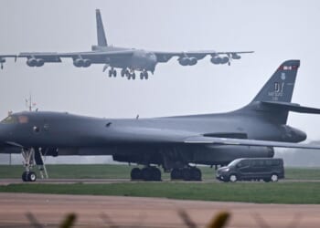 A U.S. Air Force Boeing B-52 Stratofortress bomber jet lands on the runway, beyond a USAF Rockwell B-1 Lancer bomber jet, at RAF Fairford in southwest England on March 9, 2026.