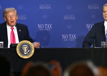 President Donald Trump speaks, flanked by Treasury Secretary Scott Bessent, during a roundtable discussion on his "no tax on tips" policy at the AC Hotel Las Vegas Symphony Park in Las Vegas, Nevada, on April 16, 2026.