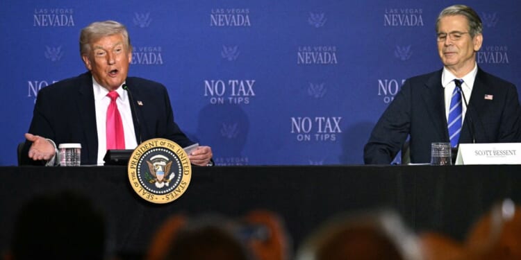 President Donald Trump speaks, flanked by Treasury Secretary Scott Bessent, during a roundtable discussion on his "no tax on tips" policy at the AC Hotel Las Vegas Symphony Park in Las Vegas, Nevada, on April 16, 2026.