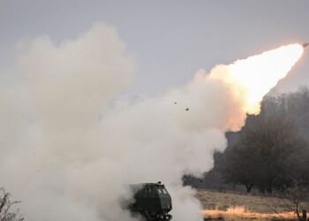 NATO soldiers operate a High Mobility Artillery Rocket System launcher during the Dynamic Front 26 exercise at the Cincu Training Area in Cincu, Romania, on Feb. 9, 2026.