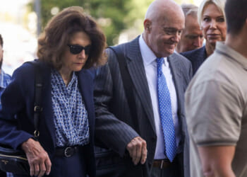 The parents of Charlie Kirk walk to the courthouse.