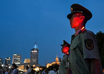 Chinese paramilitary police stand guard on the Bund in Shanghai on July 17, 2026.