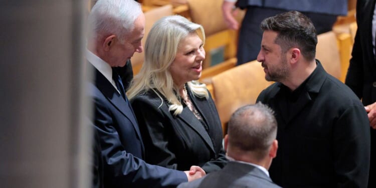 Israeli Prime Minister Benjamin Netanyahu, left, and his wife Sara Netanyahu greet Ukraine President Volodymyr Zelenskyy Tuesday at the conclusion of the funeral service for the late GOP Sen. Lindsey Graham of South Carolina at the Washington National Cathedral in Washington, D.C.