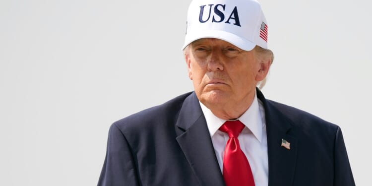 U.S. President Donald Trump wearing a hat that says "USA"